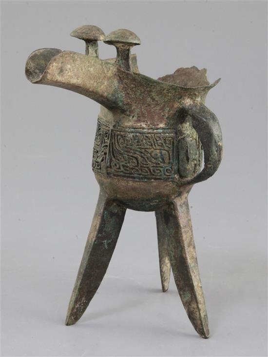 A Chinese archaic bronze tripod ritual wine vessel, Jue, Shang dynasty, 13th-12th century B.C., Anyang, 17cm high, large losses to rim